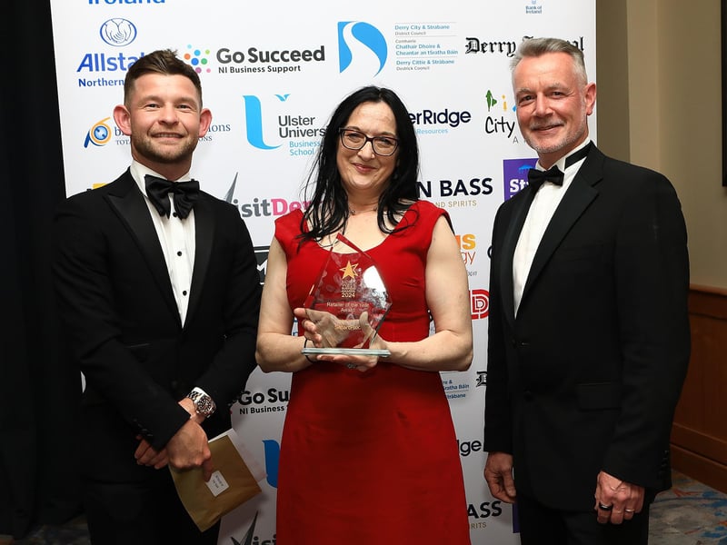 Jenni Doherty, owner of Little Acorns Bookstore, winner of Retailer of The Year Award pictured with Marc McLaughlin of SmartPay NI, and Hugh Hegarty, Chairman of CCI.