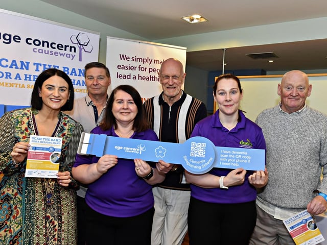Mrs Eibhlin O’HHagan, Oajgrove Integrated Primary School, alongside DEEDS staff and members Mick Canny, Wendy McLaughlin, Leonard Mills Kathleen McNaught and Gerard McGill at the launch of the ‘Scan the Band’ Dementia Safeguarding Scheme in the Guildhall. Photo: George Sweeney