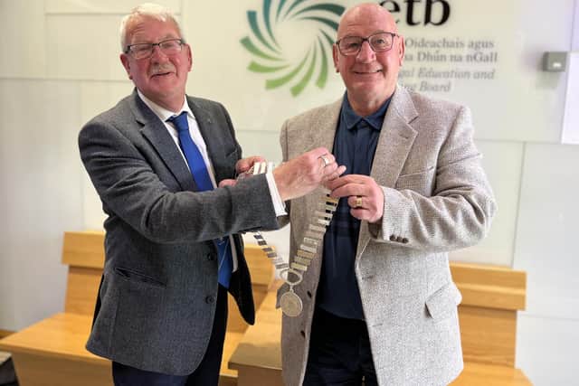 Outgoing Donegal ETB Chairperson Colr Donal Coyle, left, hands over the chain of office to newly elected Donegal ETB Chairperson Colr Terry Crossan.