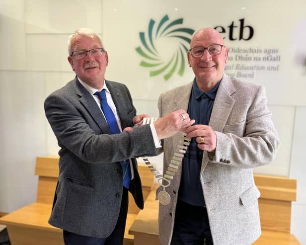 Outgoing Donegal ETB Chairperson Colr Donal Coyle, left, hands over the chain of office to newly elected Donegal ETB Chairperson Colr Terry Crossan.