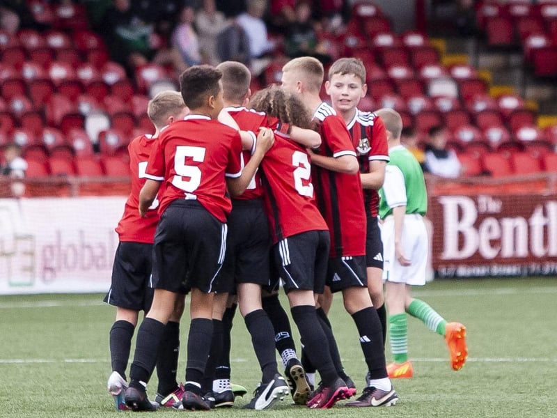 Crusaders players celebrate their opening goal in Saturday’s final.