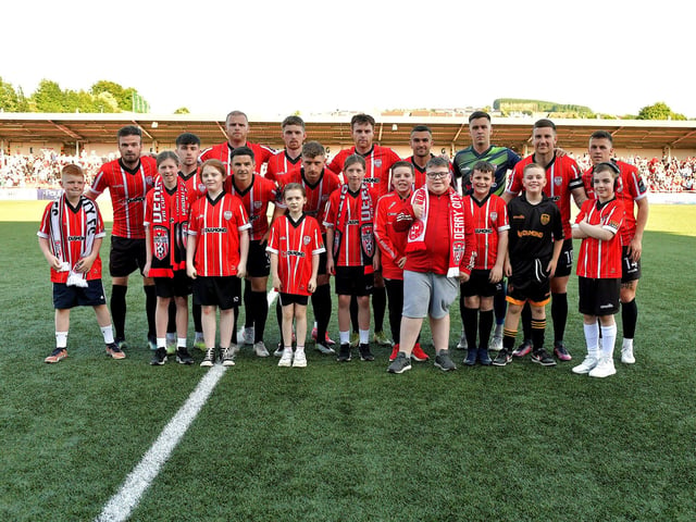Mascots pictured with Derry City’s starting eleven against Shelbourne in the Ryan McBride Brandywell Stadium. Photo: George Sweeney. DER2321GS - 77