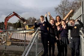Pupils celebrate the commencement of demolition work at Holy Child Primary School with Principal, Mrs. Pat Concannon.