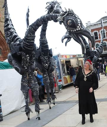 Mayor Sandra Duffy is surprised by a Saurus dinosaur in Guildhall Square as the Halloween celebrations get off to a great start. (Photo - Tom Heaney, nwpresspics)