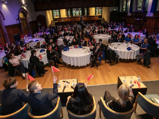 RED FLAG VOTE. . . .Conference delegates using red flags to vote during the Question and Answer session at Wednesday's 'Be The Change' conference. (Photos: jIm McCafferty Photography) : .