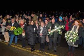 Local people, friends and relatives gather at Strabane Old Road on Tuesday evening for a wreath laying event marking the 50th Anniversary of the Annie’s Bar massacre. Photo: George Sweeney. DER2251GS – 13