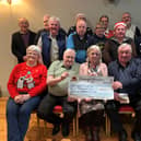 The Santa Tractor Run Committee with Deborah Toland, Treasurer of the Donegal Hospice accepting the cheque on behalf of the Hospice.