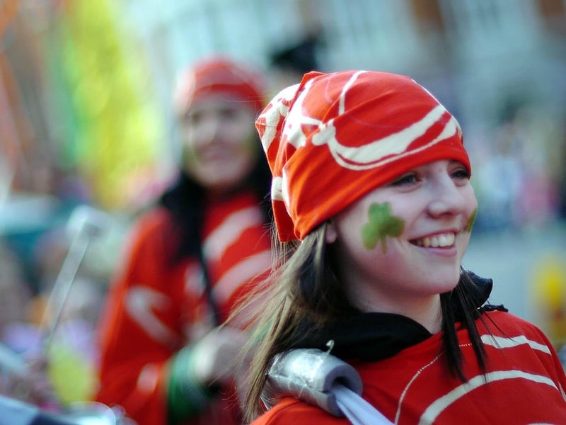 Members of the Strathfoyle Youth development group make their way through Derry's Diamond for the start of the St Patrick's day parade. : St Patrick's Day in Derry in 2006.