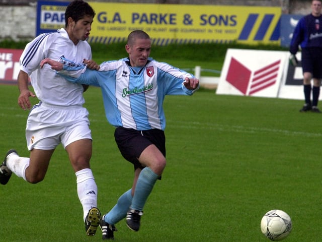 Tommy McCallion in a race for the ball.