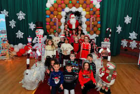 Mrs Spence’s P3 class pictured with Santa during his visit to St Eithne’s Primary School on Friday. Photo: George Sweeney. DER2250GS – 46