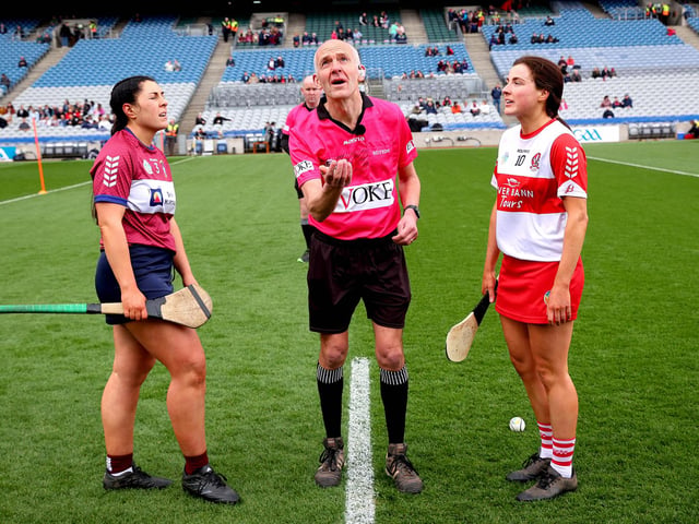 Westmeath’s Julie McLoughlin and Aine Barton of Derry with referee Cathal McAllister at the coin toss of Sunday's league final. (Photo: INPHO/Ryan Byrne)