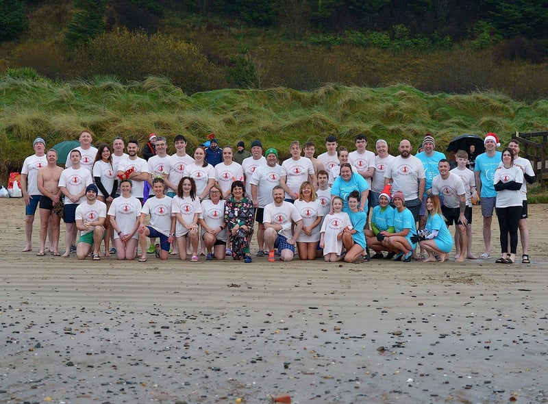 Swimmers who took part in the annual Children’s Eye Cancer Christmas morning charity swim at Ludden beach, Buncrana. Photo: George Sweeney. DER2252GS – 21