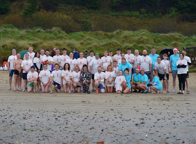Swimmers who took part in the annual Children’s Eye Cancer Christmas morning charity swim at Ludden beach, Buncrana. Photo: George Sweeney. DER2252GS – 21