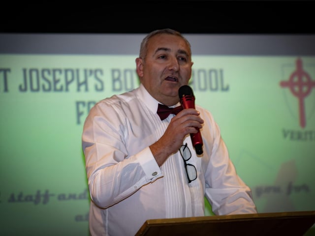 Mr. Gerry Beattie, Senior Teacher, addressing the attendance at the St. Joseph's Boys School Formal on Friday night at the Waterfoot Hotel, Derry.  : .