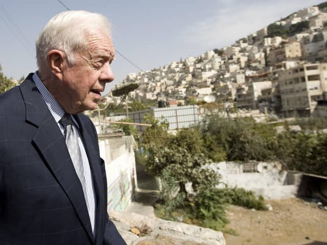 Former US president Jimmy Carter in the Arab east Jerusalem neighbourhood of Silwan. (Photo credit should read AHMAD GHARABLI/AFP via Getty Images)