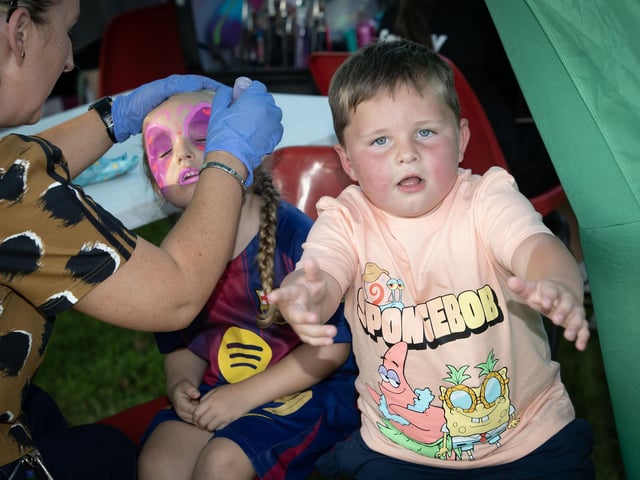 A young festival-goer can't wait to get his face painted, during the Feile '25 event at Abercorn Park, Derry on Tuesday evening. (Photos: Jim McCafferty Photography)