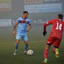 Institute defender Rhys McDermott surveys his option against Loughgall.