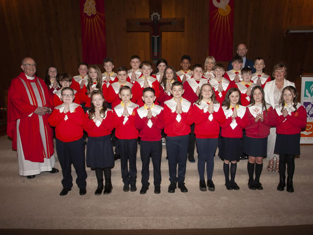 Pupils from Steelstown Primary School who received the Sacrament of Confirmation at Our Lady of Lourdes Church, Steelstown on Monday afternoon last from Monsignor Donnelly. Included in photo is Principal, Mrs Siobhan Gillen and P7 teacher, Mr. Vincent Feeney. (Photo: Jim McCafferty Photography)