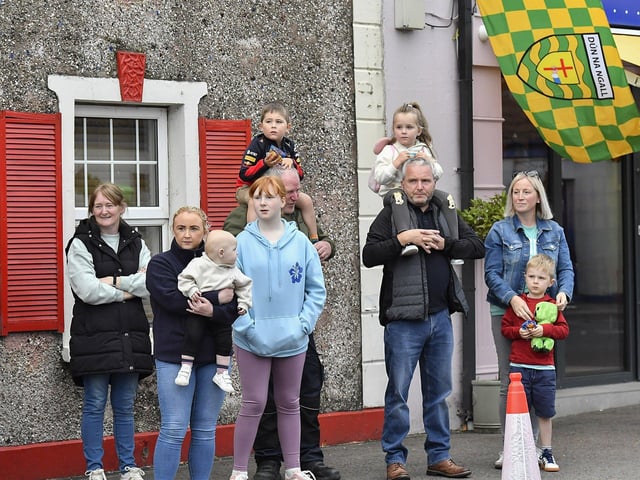 Spectators at the Muff Feile opening parade makes on Friday evening. Photo: George Sweeney