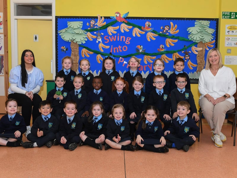 Mrs Harkin, teacher, (on the right) and classroom assistant Ms Tabbitt with their P1 class at Hollybush Primary School.