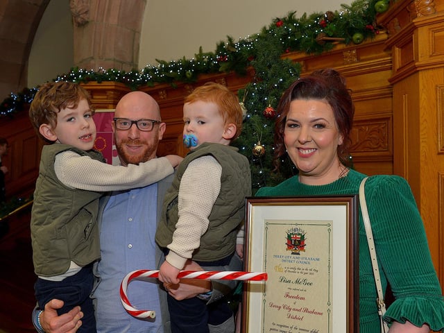 Lisa McGee, creator of Derry Girls, who was conferred with the Freedom of Derry City and Strabane by councillors yesterday evening pictured with her husband Tobias Beer and children in the Guildhall. Photo: George Sweeney. DER2249GS – 04