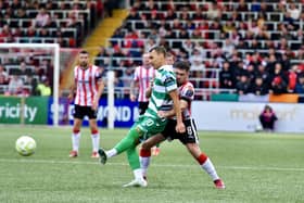 Derry City's Adam O'Reilly gets tight to Graham Burke during the 2-1 loss to Shamrock Rovers. Photographs by Kevin Morrison.