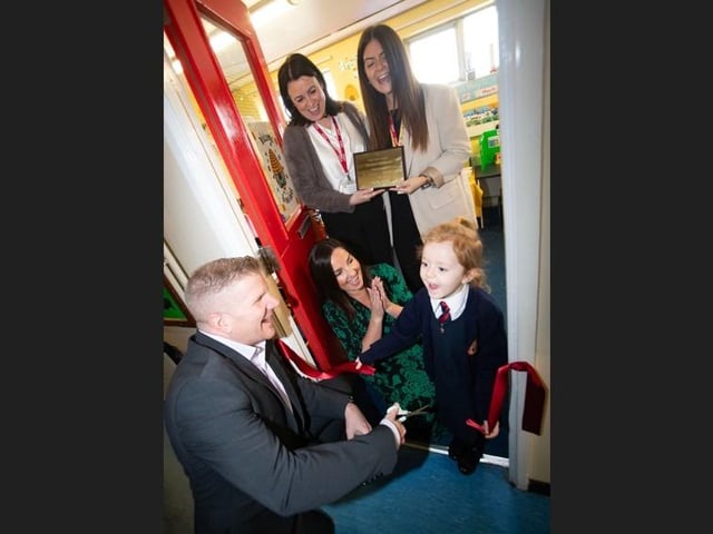 NEW THRIVE HIVE OPENED AT HOLY CHILD PS. . . .Young Holy Child PS pupil Hannah Collins helping Children's Commissioner Chris Quinn cut the ribbon to officially open the school's new 'The Thrive Hive' on Thursday morning. Included in photo is Principal, Mrs. Pat Concannon, Vice Principal, Mrs. Aine O'Connor and teacher Miss Rachel Lynch. (Photos: Jim McCafferty Photography)