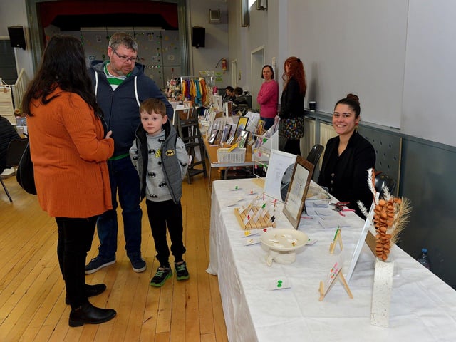 Browsing Nena’s Clays stall at the Spring Craft Fair held in St Mary’s Hall Muff on Sunday last. Photo: George Sweeney. DER2310GS – 004