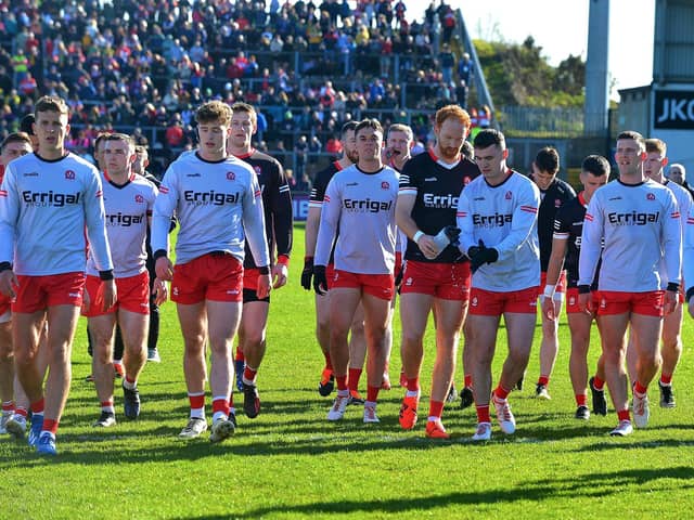 The Derry players return to the changing rooms before Saturday's Championship clash.. Photo: George Sweeney