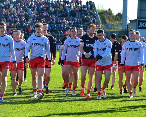 The Derry players return to the changing rooms before Saturday's Championship clash.. Photo: George Sweeney