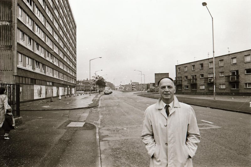 Dr Raymond McClean at Rossville Street with the Rossville flats in the background.