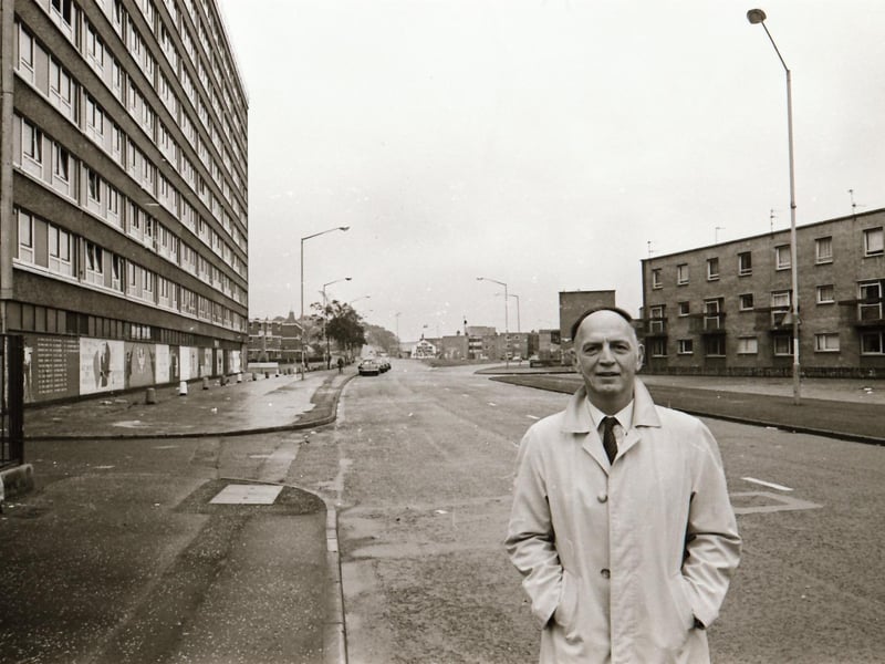 Dr Raymond McClean at Rossville Street with the Rossville flats in the background.