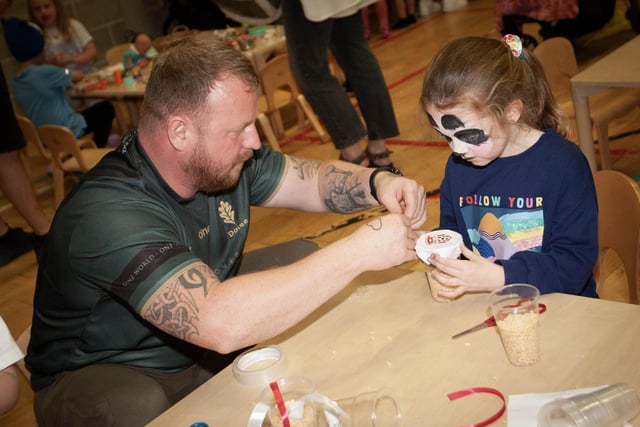 Even dads were getting in on the act making Derry City Crackers during Friday night's fun.