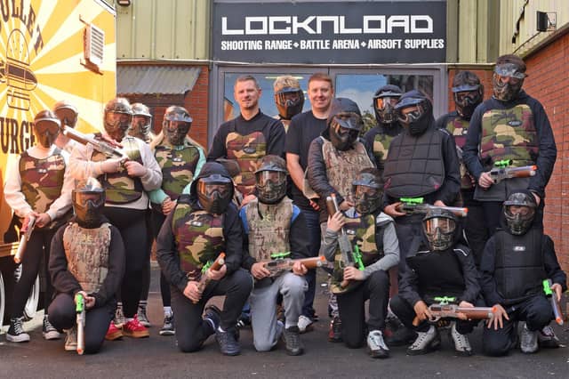 Enjoying activities at Lock ‘N’ Load combat laser arena in Derry are (from left), Colly Mclaughlin, Project Coordinator of Galliagh Community Response Group, Andy Mullan, Housing Executive Good Relations Officer, West and a group of happy young participants.