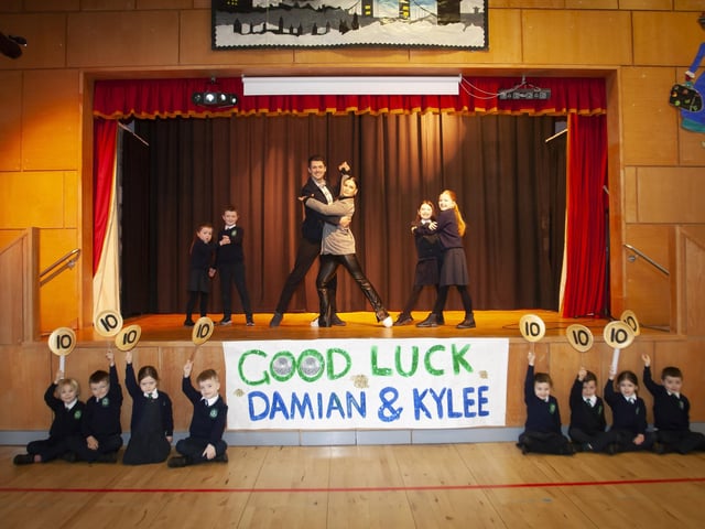 Some young dancers and supporters pose for a photo with Damian and dance partner Kylee on Tuesday.