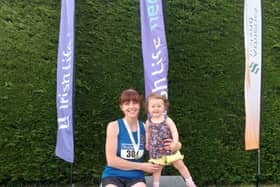 Olympian’s new All Ireland Masters F40 100m champion, Karen O’Donnell, celebrates with her daughter.