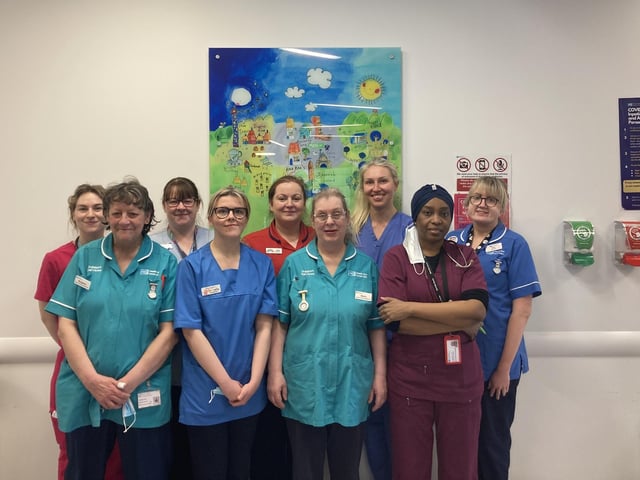 A group of staff celebrating International Women's Day.