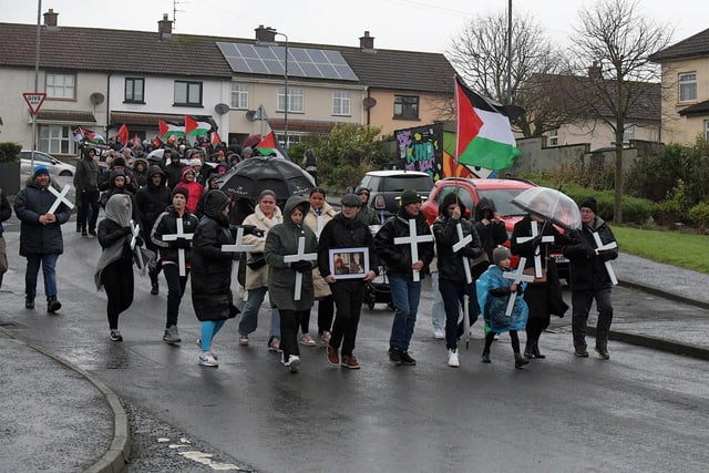 Relatives carrying white crosses lead the Bloody Sunday 52nd commemoration march along Rathlin Drive on Sunday afternoon. Photo: George Sweeney