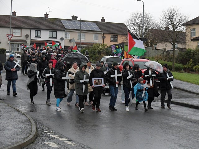 Relatives carrying white crosses lead the Bloody Sunday 52nd commemoration march along Rathlin Drive on Sunday afternoon. Photo: George Sweeney