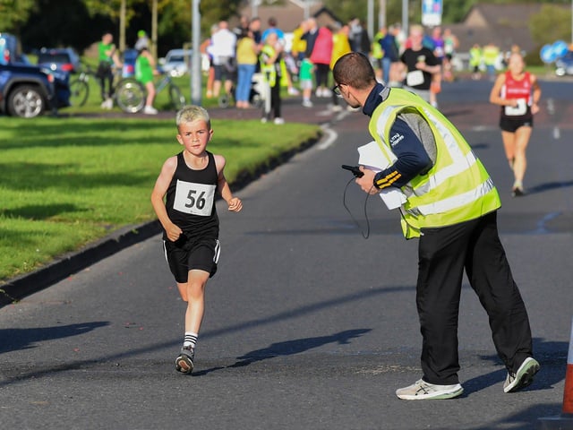 Leon Fisher, Rise Running Club, finshes the inaugural Galliagh Féile 5K road race on Friday evening.  Photo: George Sweeney