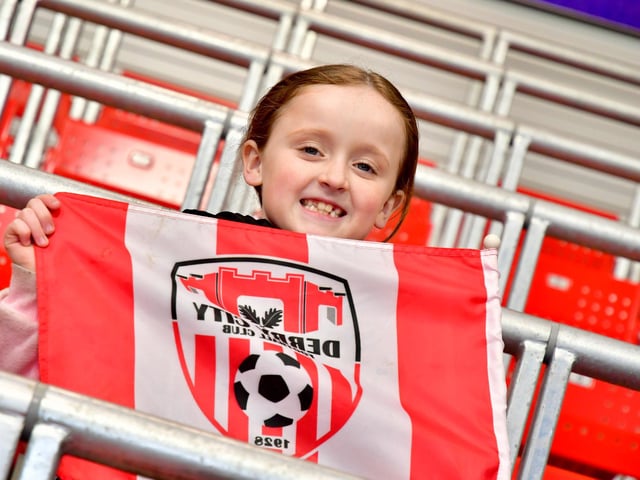 This young Derry City supporter flying the flag.
