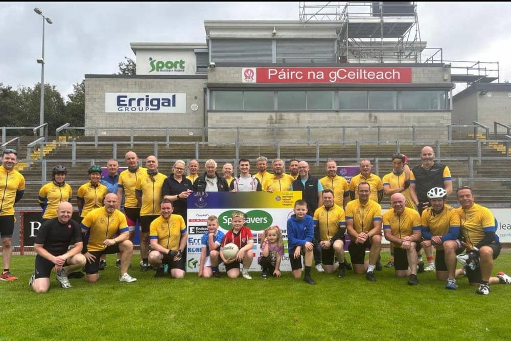Store Directors at Specsavers Derry, Maeve Walsh and Seán McCauley pictured with Vincent Doran, and the Giro d’JJ team.