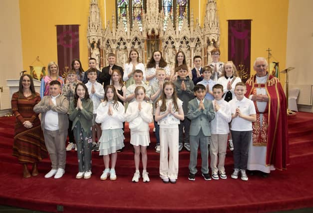 Mrs. Forbes P7 class at Good Shepherd Primary School who received the Sacrament of Confirmation from Fr. Michael Canny at Chapel Road Church on Friday last. Included in photo is Mrs. Suzann McCafferty, Principal. (Photos: Jim McCafferty Photography)
