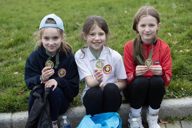 Three very happy young ladies with their medals after Tuesday's 1km race. (Photos: JIm McCafferty Photography)