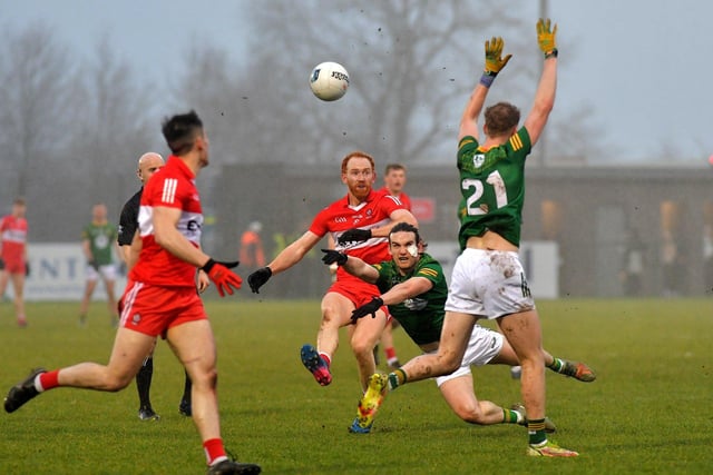 Derry’s Conor Glass gets off a pass under pressure from Meath’s Cillian O’Sullivan during the Allianz Football League game at Owenbeg on Saturday. Photo: George Sweeney. DER2308GS – 55