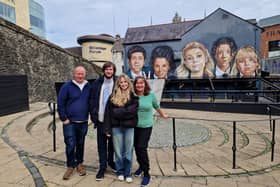 Helen Hamlett pictured with her family from Warrington in England on a visit to the Derry Girls mural.