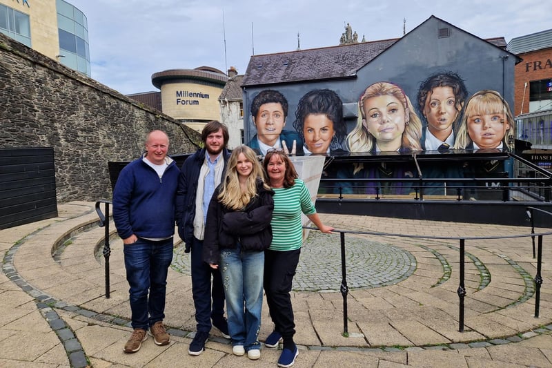 Helen Hamlett pictured with her family from Warrington in England on a visit to the Derry Girls mural.