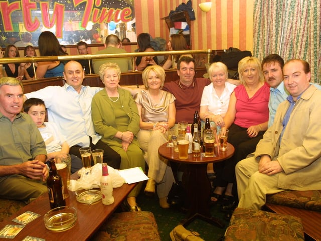 Frank Doran, Aaron McCusker, Patsy McCusker, Magdalene Nelis, Deborah McCusker, Mickey McCusker, Sally McCusker, Ann McCusker, Jerry McCusker, and Johnny McCusker in party mood