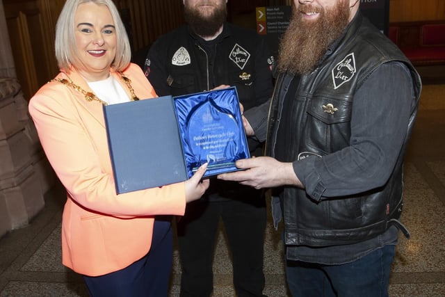 The Mayor, Sandra Duffy pictured with Kevin and Michael Kelly during Friday night’s presentation at the Guildhall in honour of The Outlaws Motorcycle Club.:.