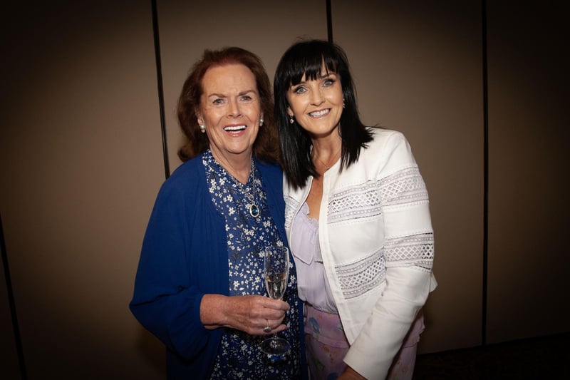 Úna is congratulated by one of her former pupils, Margaret Ross.